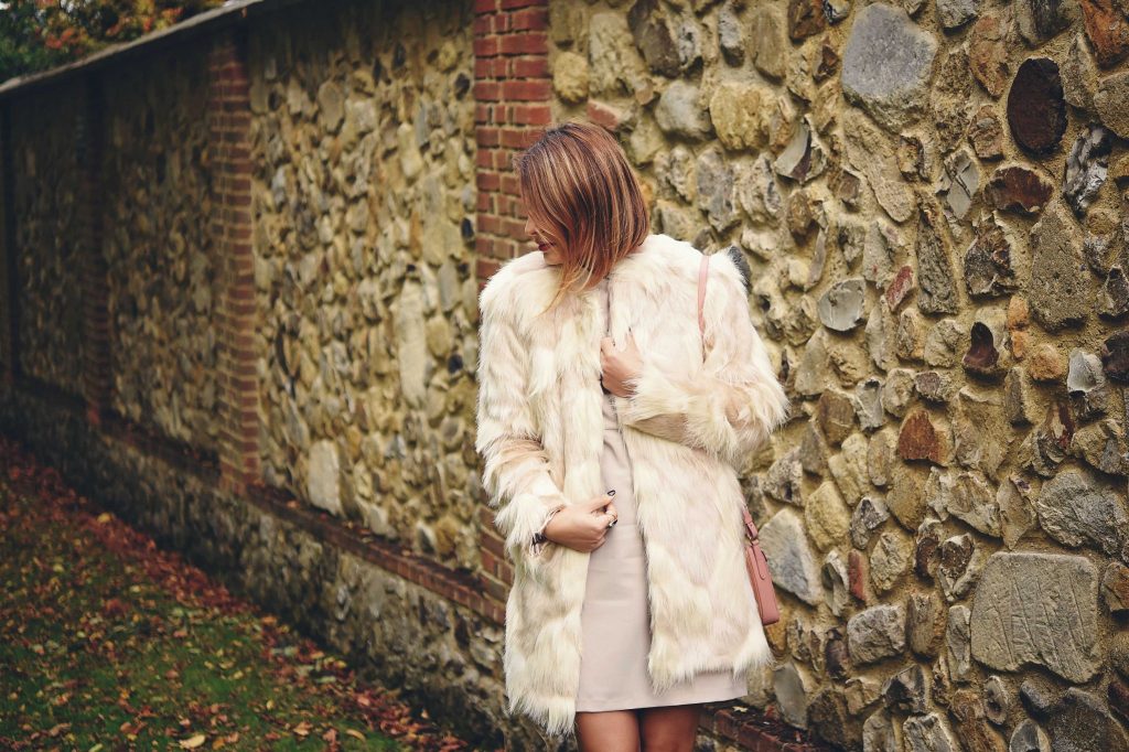 fur coat and bodycon dress