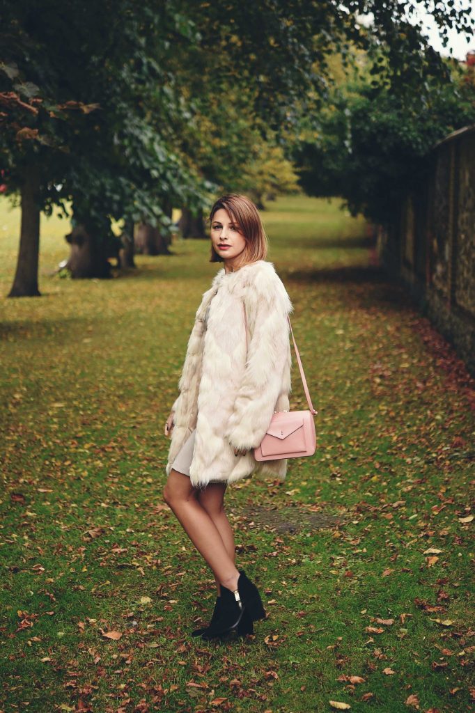 fur coat and bodycon dress